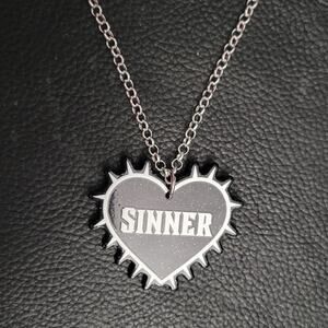 "Sinner" spiked gilttery heart 2-sided black and white gothic necklace